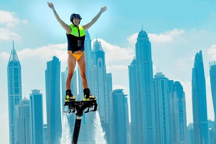 Experience the freedom of flying above the water at Jumeirah Beach surrounded by Dubai's stunning skyline. An unforgettable adventure awaits you in this dynamic city.